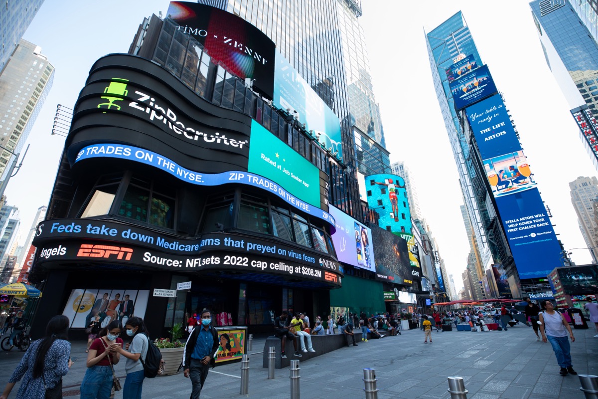 Wide daytime view of the ZipRecruiter Times Square takeover